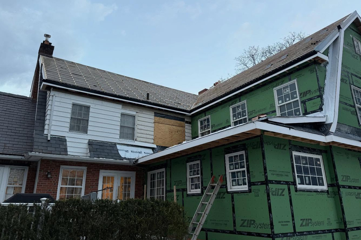 Residential siding options include grey cedar-style shingles, classic white lap siding, and protective orange or green ZIP System sheathing used during active construction in Long Island.
