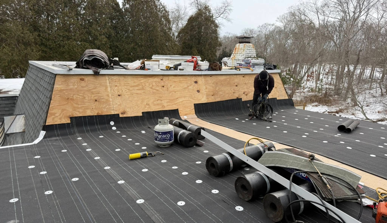 Roof replacement by Aaron Roofing Corp in progress