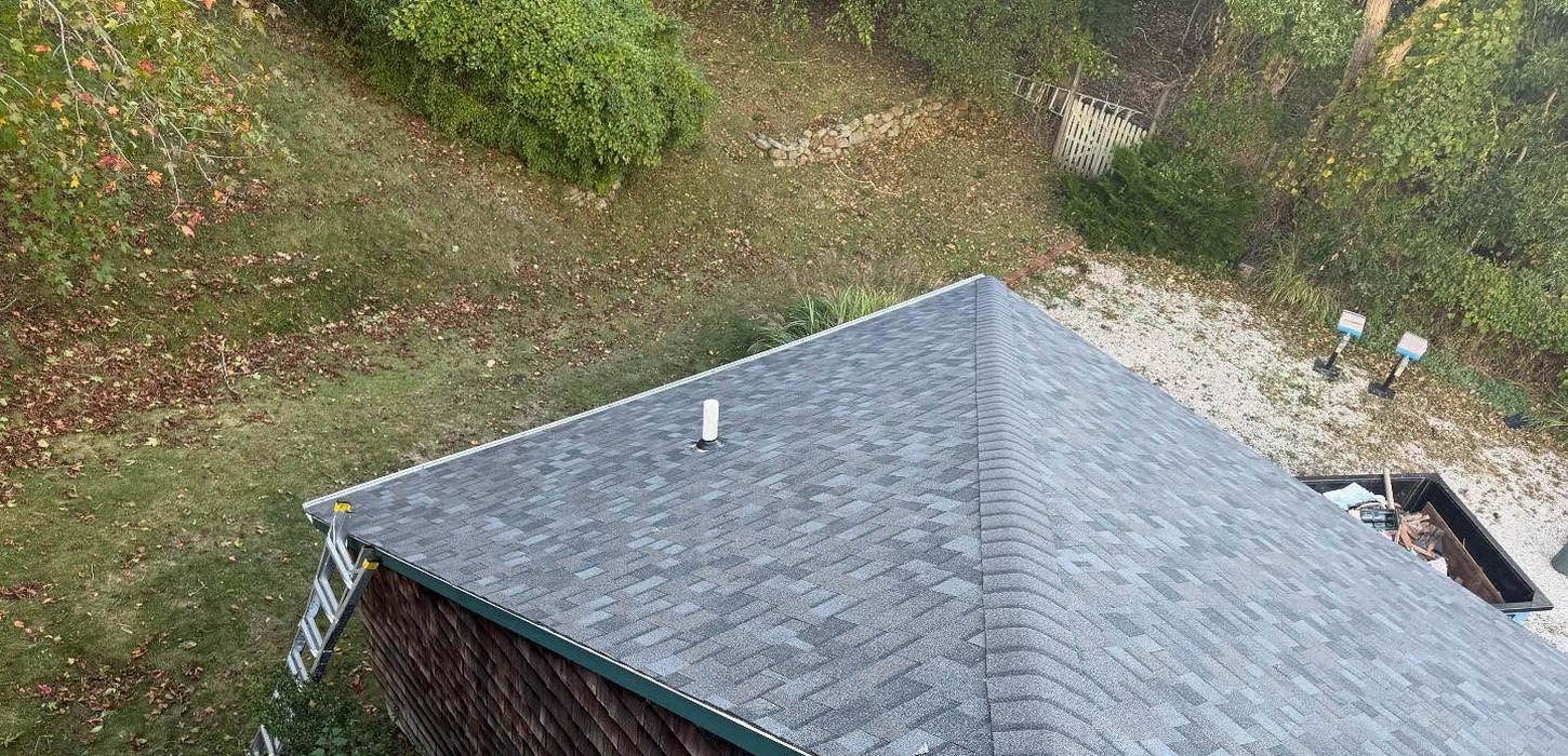 Overhead view of a newly shingled roof completed by a professional roofing contractor in Nassau County.