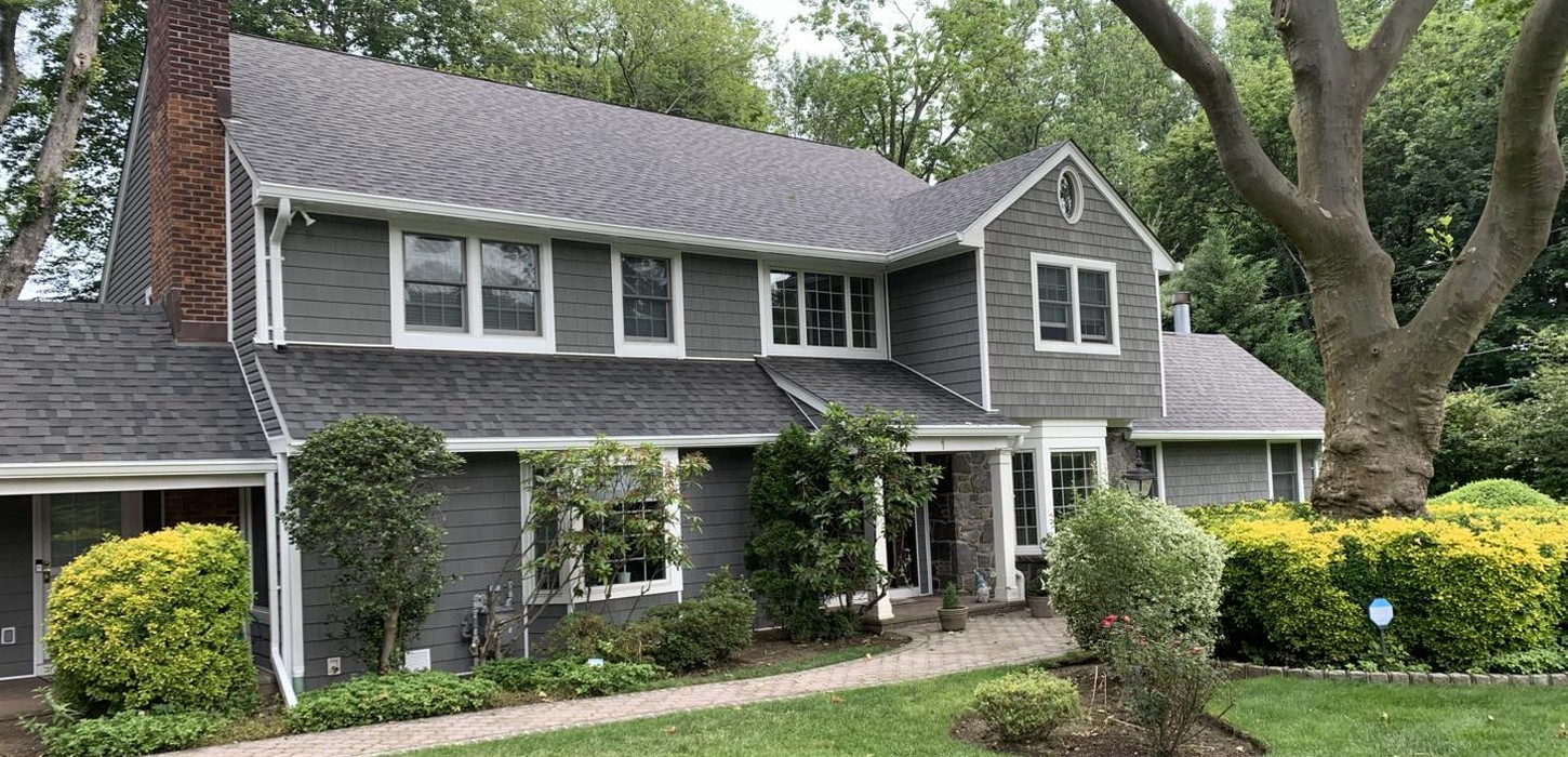 Close-up of durable composite asphalt shingles, among the best roofing materials for Nassau County